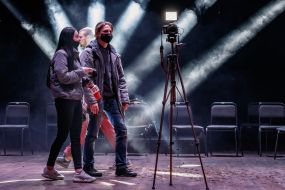 Journalists monitor the operation of the updated sound and lighting equipment