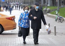Passers-by in respirator masks