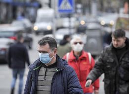 Passers-by in respirator masks