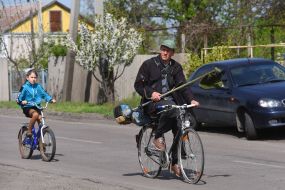 Man and girl on bicycles