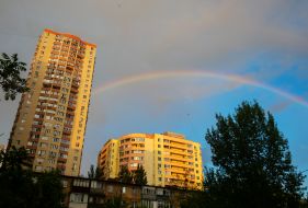 Rainbow in the sky over the houses