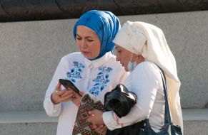 Muslim women in embroidered shirts