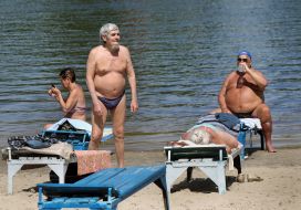 People relax on the beach