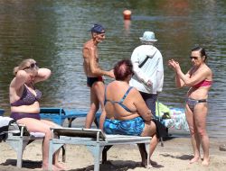 People relax on the beach
