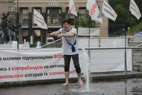 The graduate bathes in a fountain