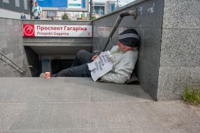 Elderly man on the steps of the underpass