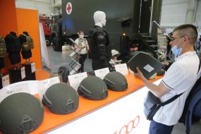 Visitor examines helmets