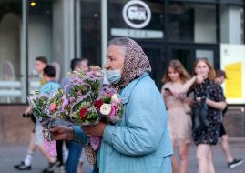 Old woman selling flowers
