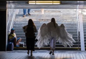 Woman in the costume of an angel in the underpass in Kiev