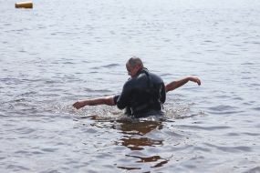 Rescue divers remind vacationers about the rules of conduct near the water on the beach in Kiev