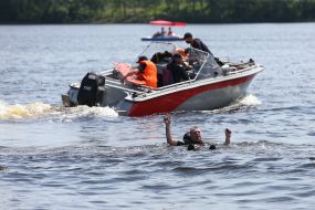Rescue divers remind vacationers about the rules of conduct near the water on the beach in Kiev