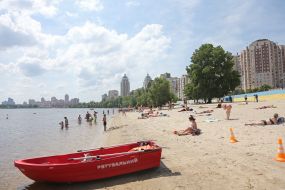 People relax on the beach