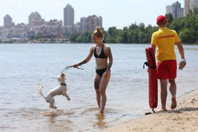 People relax on the beach