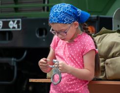 Girl examines handcuffs