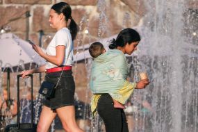 Woman with a child asking for alms