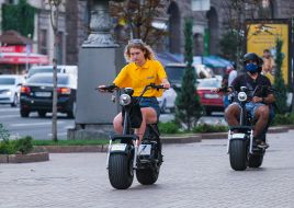 Girl and guy on electric bikes
