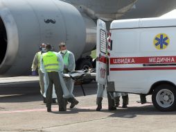 The servicemen are transported on board the plane