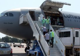 The servicemen are transported on board the plane