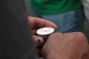Woman holding a lighted candle