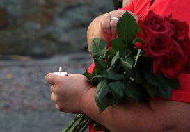 Woman holding a lighted candle