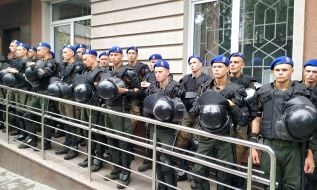 Law enforcement officers near the court building