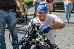 Sergey Saliy adjusts the handbike before the start of the race