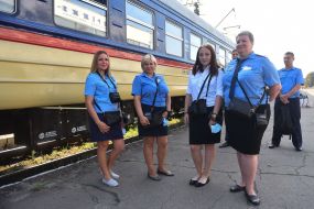 Conductor-cashier near the electric train