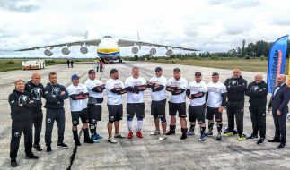 Strongmen near the AN 225 "Mriya"