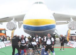 Strongmen near the AN 225 "Mriya"