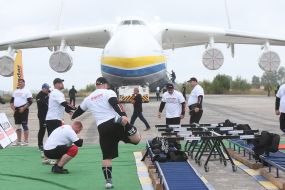 Strongmen near the AN 225 "Mriya"