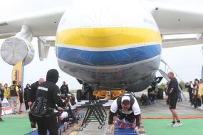 Strongmen near the AN 225 "Mriya"