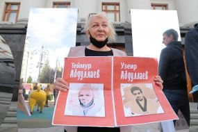 Woman holding a placard