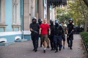 Law enforcement officers detained violators of order