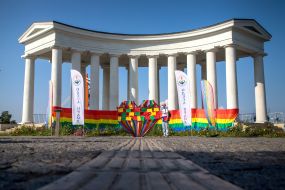 Art object in the form of a heart decorated with rainbow ribbons near the Vorontsov colonnade