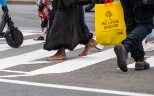 Barefoot man on the crosswalk