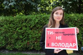 Woman holding a poster