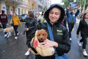 Woman with a dog in her arms