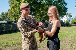 Girl holding RPK machine gun