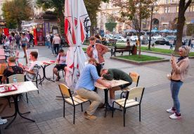 Visitors wrestle in their arms