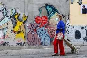 Woman in a protective mask on a street in Porto