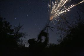 A Ukrainian serviceman fires a machine gun