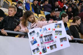 The girl holds a poster