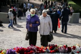 Flower laying ceremony near the monument in Babi Yar