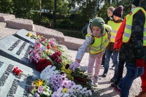 Flower laying ceremony near the monument in Babi Yar