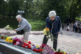 Flower laying ceremony near the monument in Babi Yar