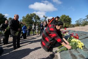 Flower laying ceremony near the monument in Babi Yar