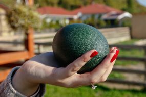 Girl holding an ostrich egg