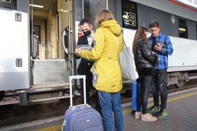 The passenger presents the documents to the conductor