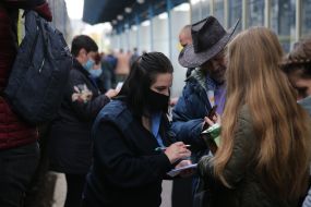 The passenger presents the documents to the conductor