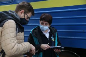 The passenger presents the documents to the conductor